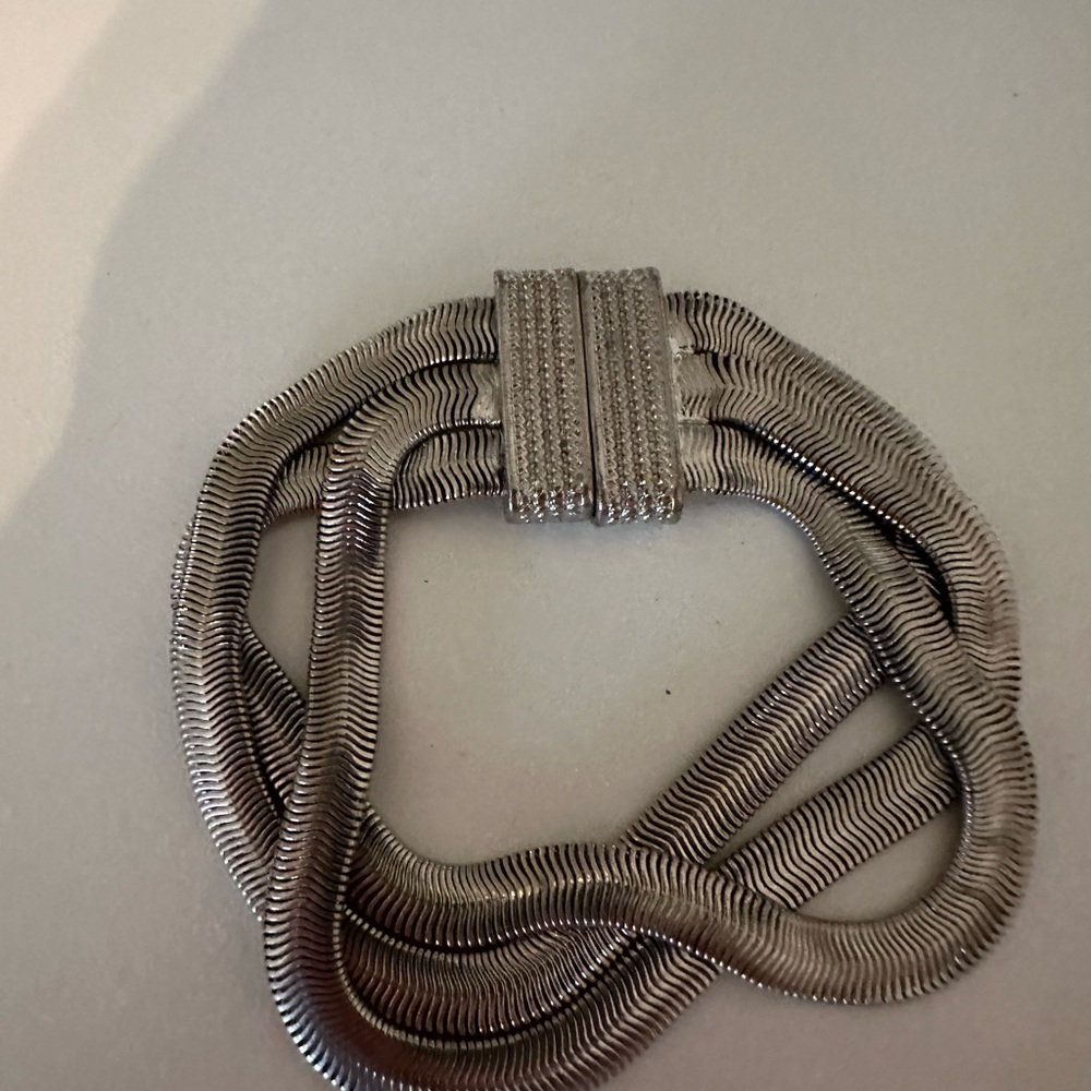 Silver rope bracelet.  Clasp is metallic.